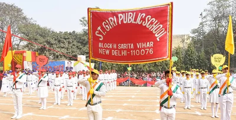 Students presenting the school flag at the annual day parade