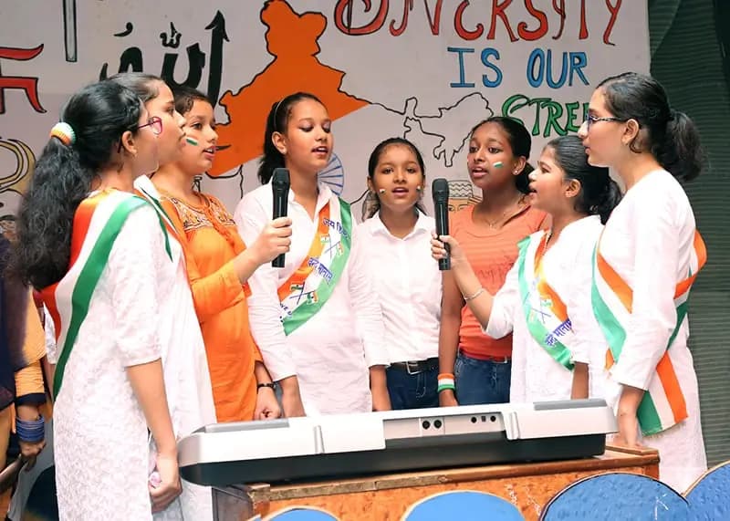 Students singing a patriotic chorus on Independence Day
